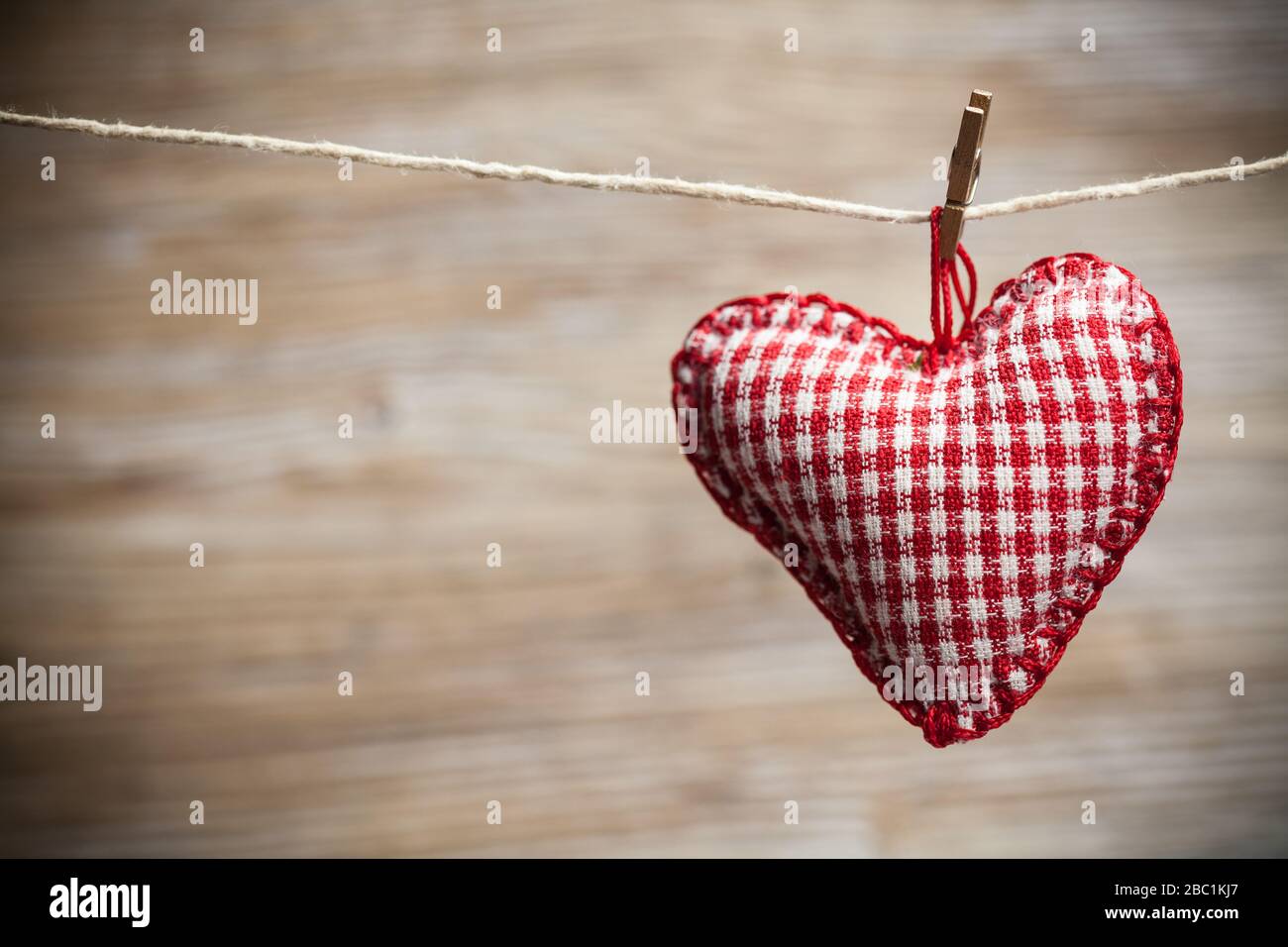 Colorful fabric hearts on wood backgrounds. Valentine's Love concept Stock Photo