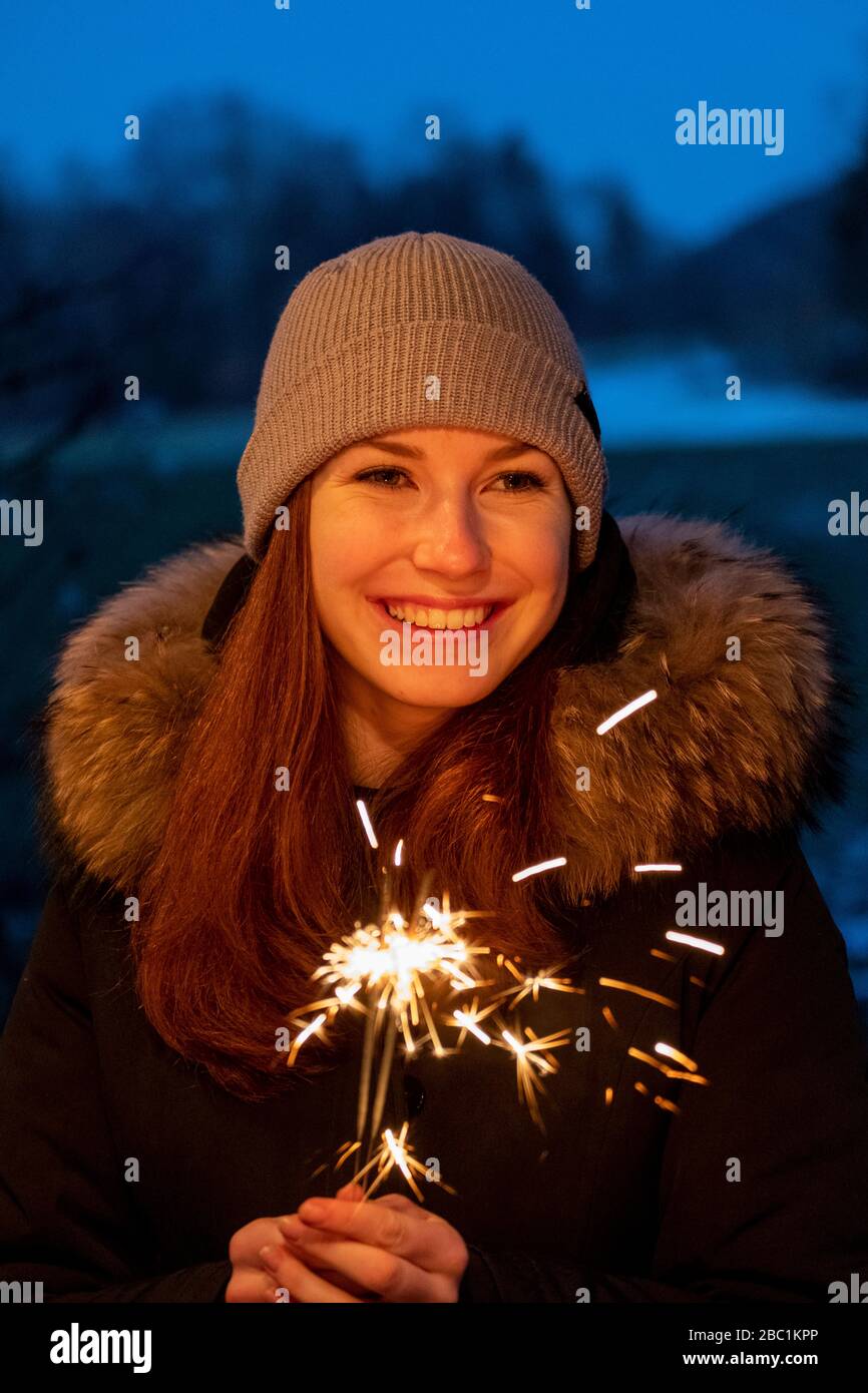 junge Frau mit Wunderkerze, Sternwerfer,  Licht, Oberbayern,  Bayern, Deutschland, Stock Photo
