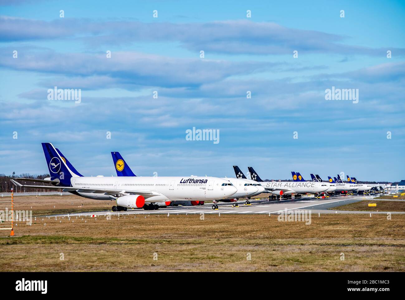 Frankfurt, Hessen/Germany - March 30 2020Lufthansa aircraft (Airbus A330 and 340) are parked on the north-west runway of Frankfurt Airport as a result Stock Photo