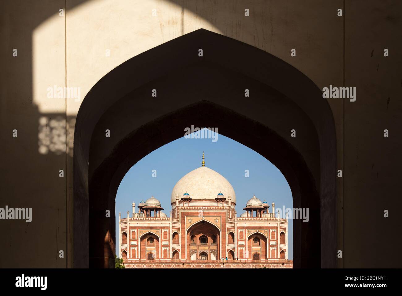Humayun’s Tomb framed by an entrance arch in New Delhi, India Stock Photo