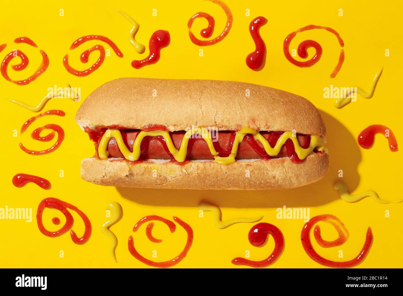 Tasty hot dog and sauces on yellow background Stock Photo Alamy