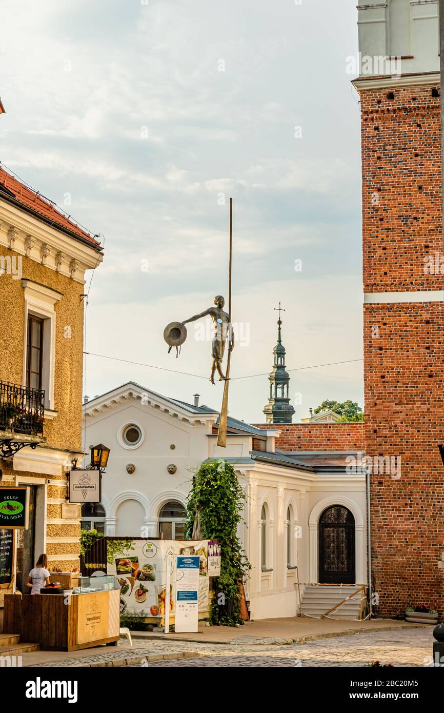 A sculpture of a tightrope walker crossing a street on a wire, Sandomierz, Poland. June 2017. Stock Photo