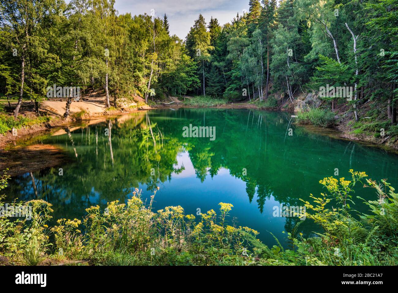 Azure Lakelet, artificial pond at Colourful Lakelets (Kolorowe Jeziorka), pyrite mining area in Rudawy Janowickie mountain range Lower Silesia, Poland Stock Photo