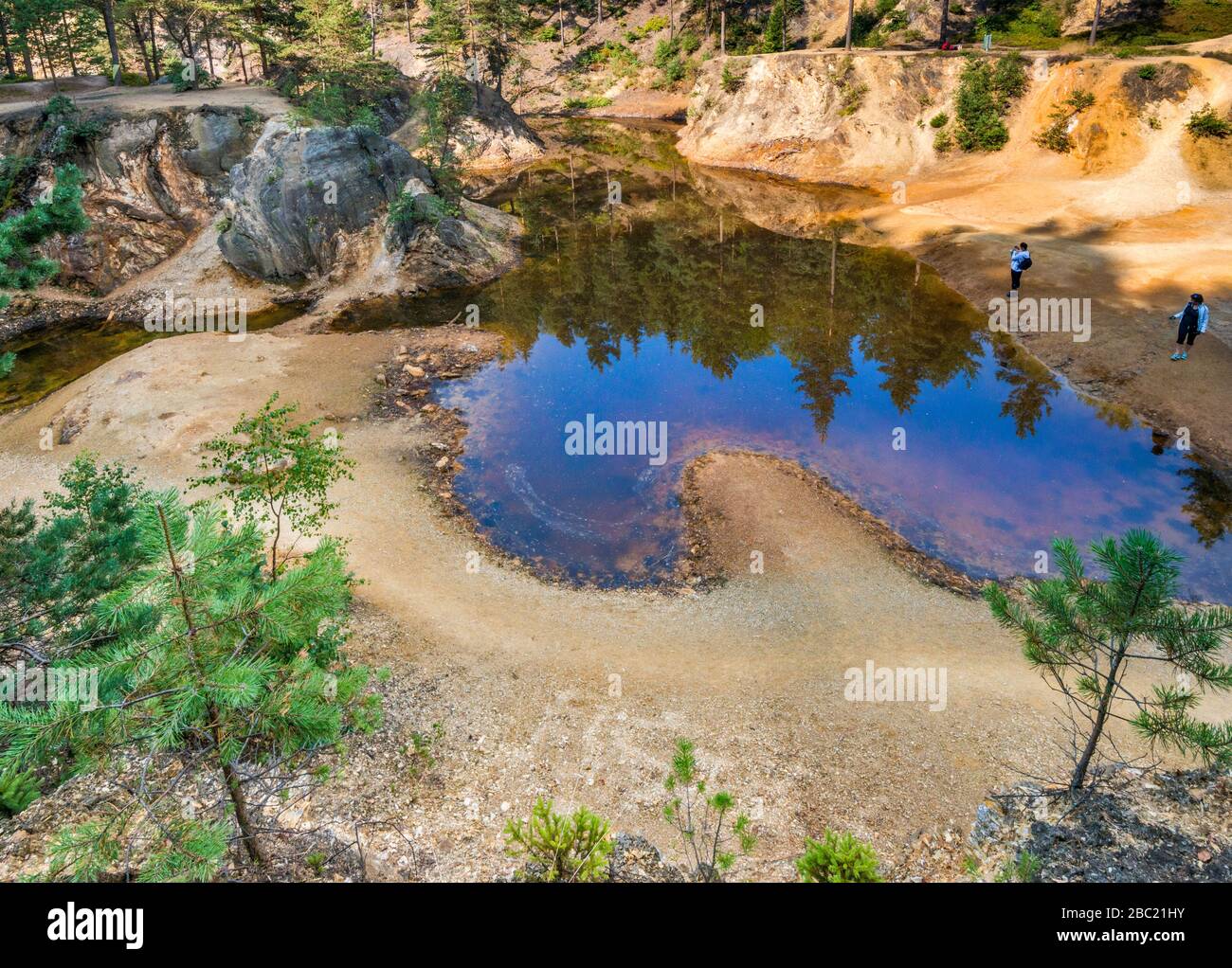 Purple Lakelet, artificial pond at Colourful Lakelets (Kolorowe Jeziorka), pyrite mining area in Rudawy Janowickie mountain range Lower Silesia Poland Stock Photo