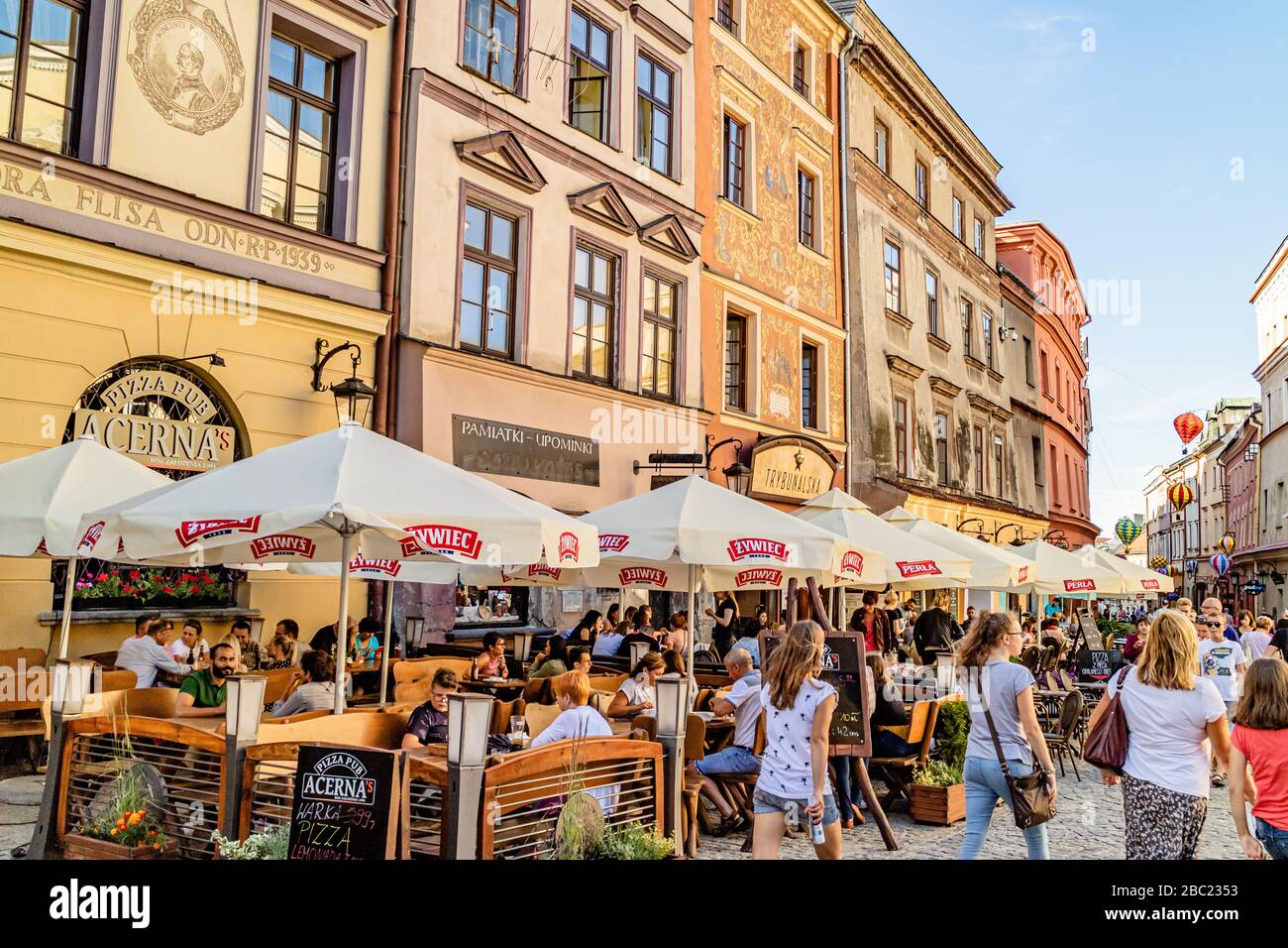 Busy restaurants with outdoor seating on the rynek or market square of Lublin's old town. Lublin, Poland. June 2017. Stock Photo
