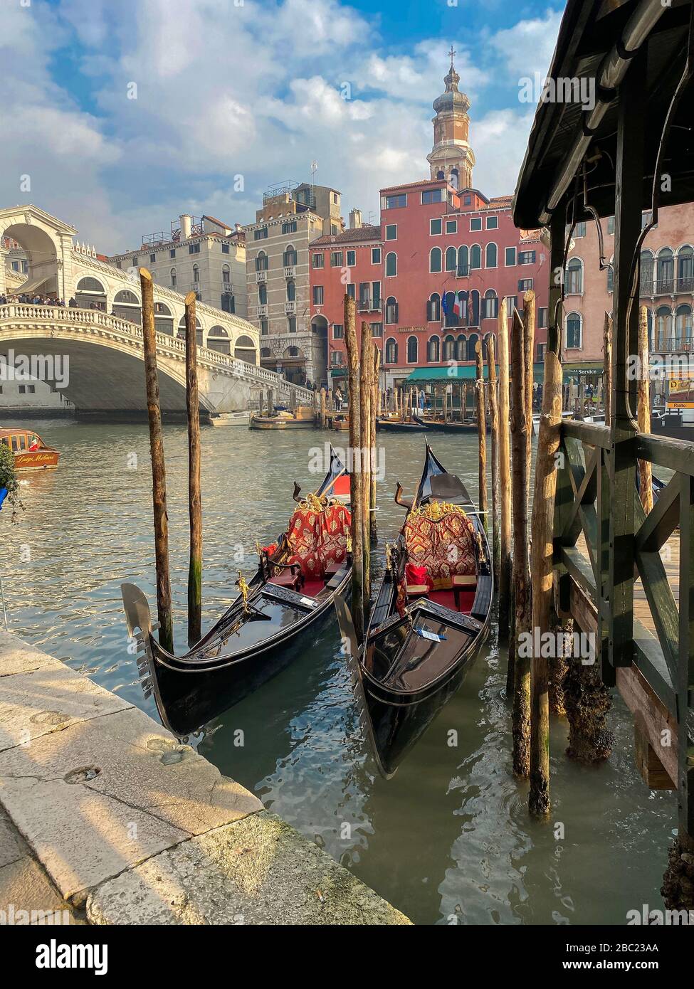 Gondolas moored up in the historic town of Venice Stock Photo