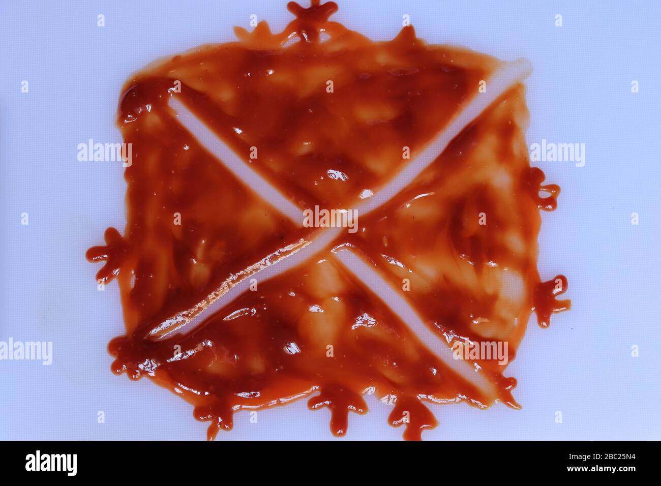 red ketchup splashes isolated on white background Stock Photo
