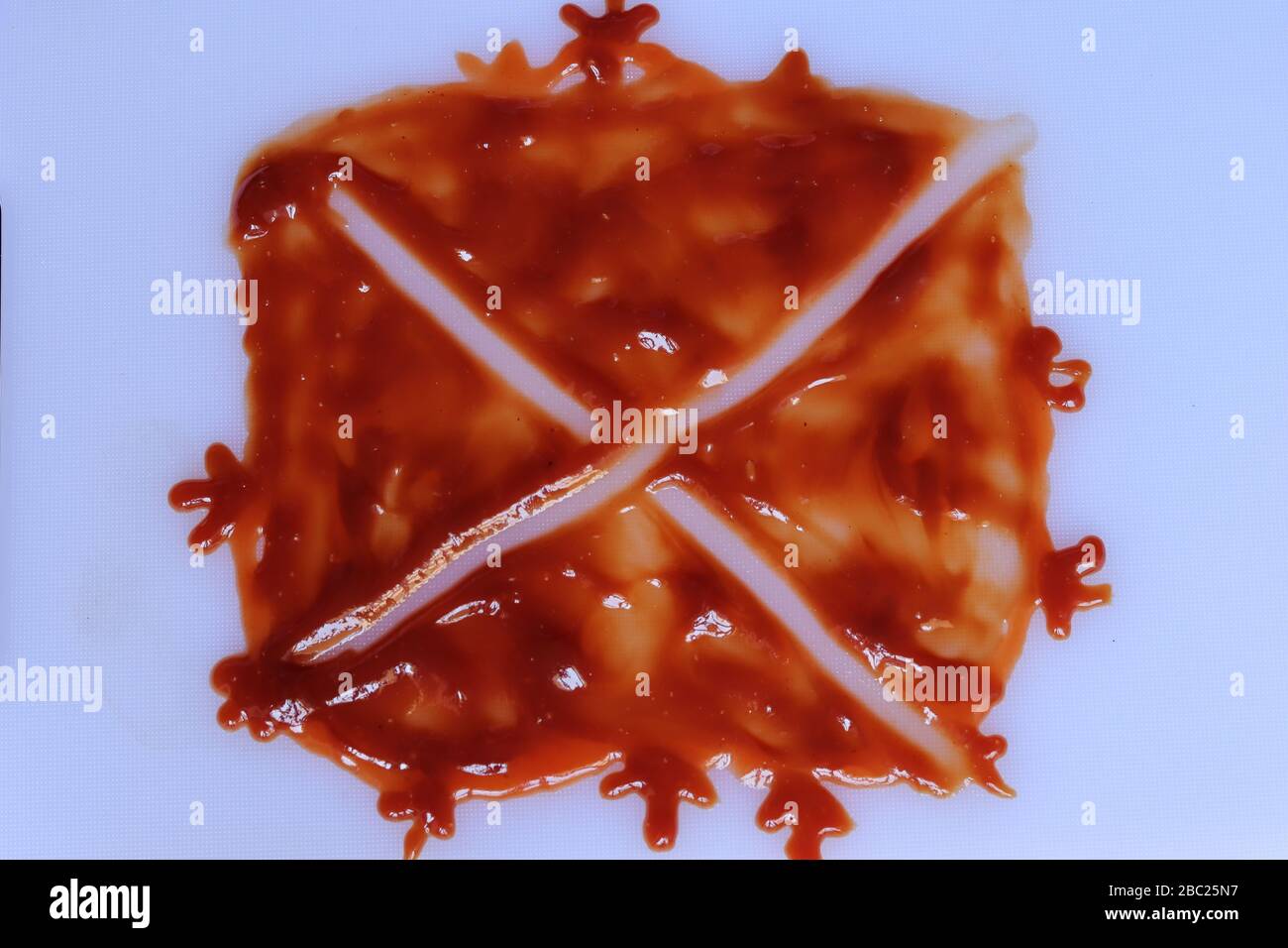 red ketchup splashes isolated on white background Stock Photo
