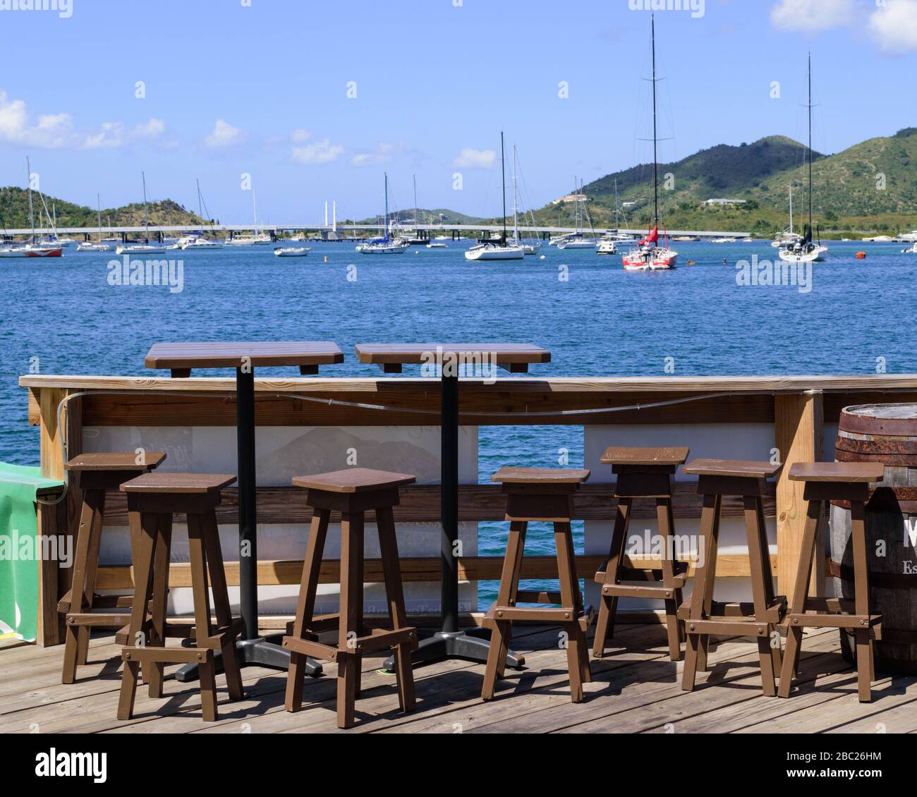 Impact of coronavirus on summer travel / tourism: normally busy, tables at SMYC Bar & Restaurant are empty while closed for Covid-19 Pandemic Stock Photo