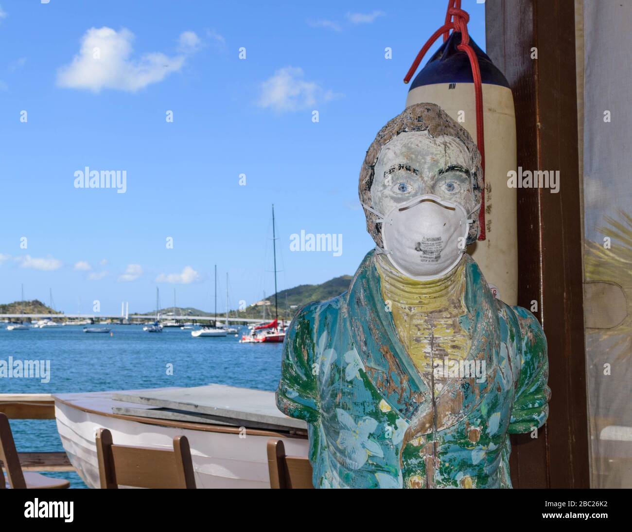 Bar mascot wears a (used) protective mask at this popular Caribbean bar and restaurant while it is closed for the Covid-19 Pandemic Stock Photo