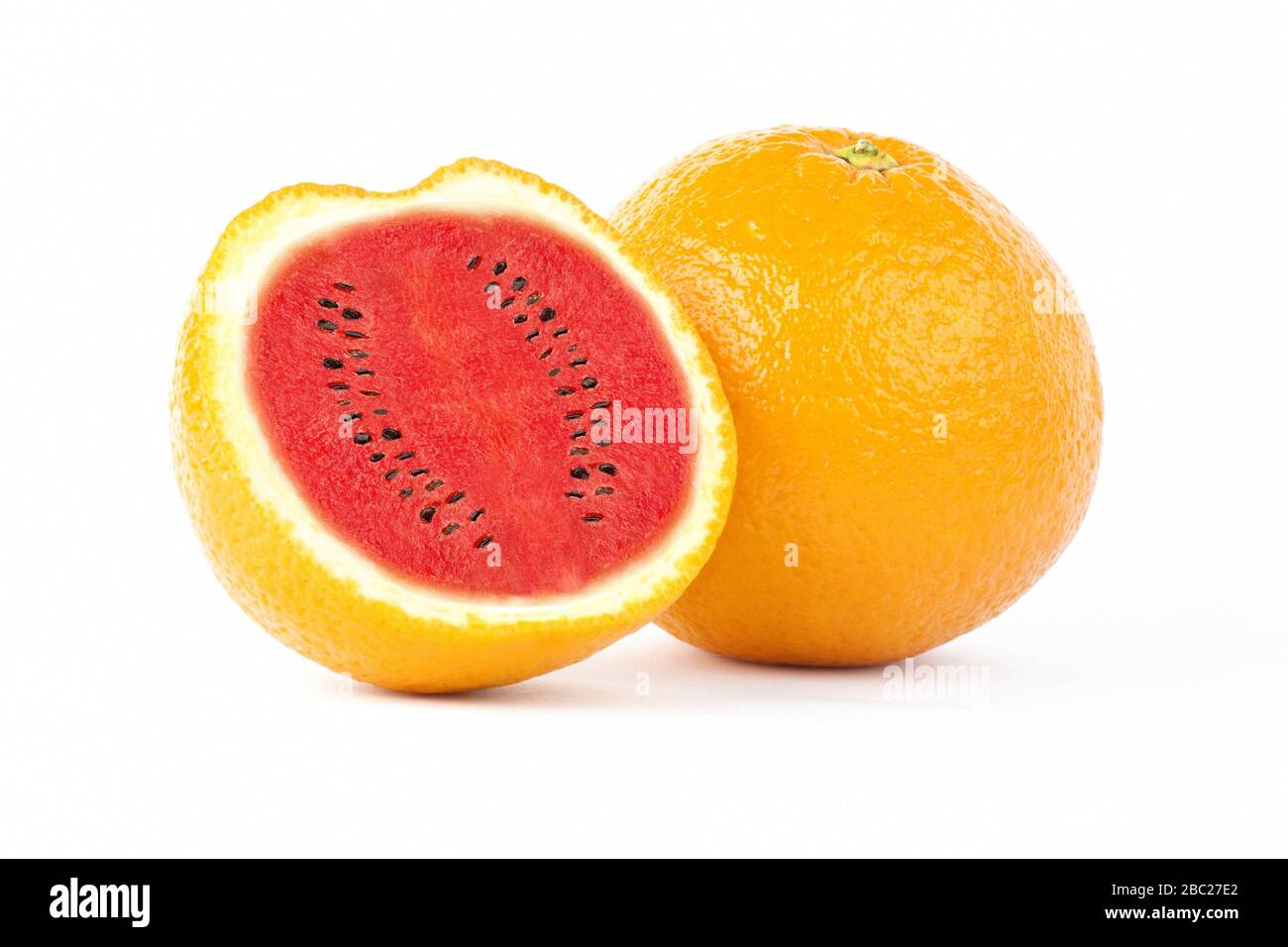 Photo manipulation of sliced orange fruit with red watermelon inside isolated on white background Stock Photo