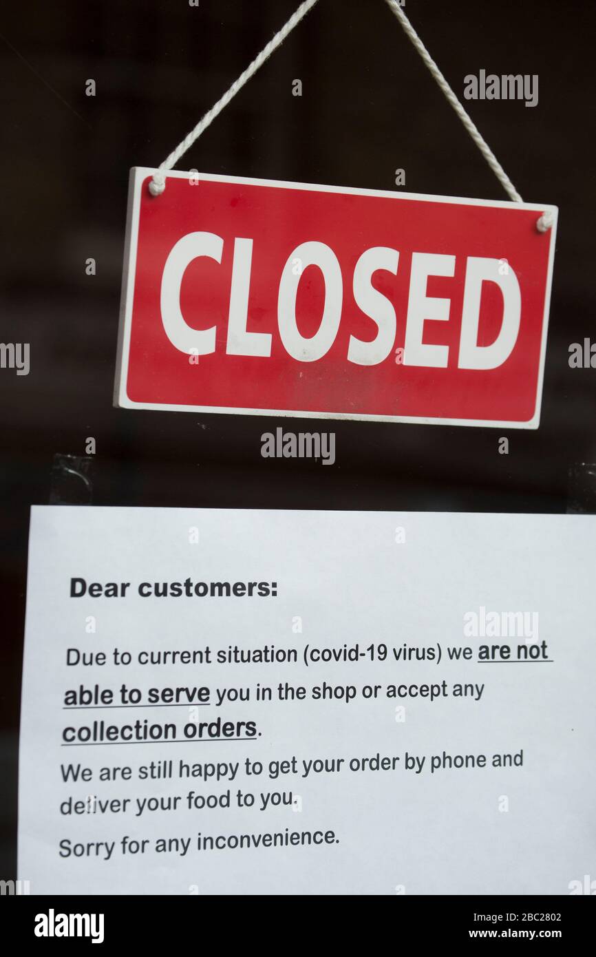 A closed sign in the window of a takeaway in Gillingham North Dorset during the Coronavirus outbreak. North Dorset England UK GB Stock Photo