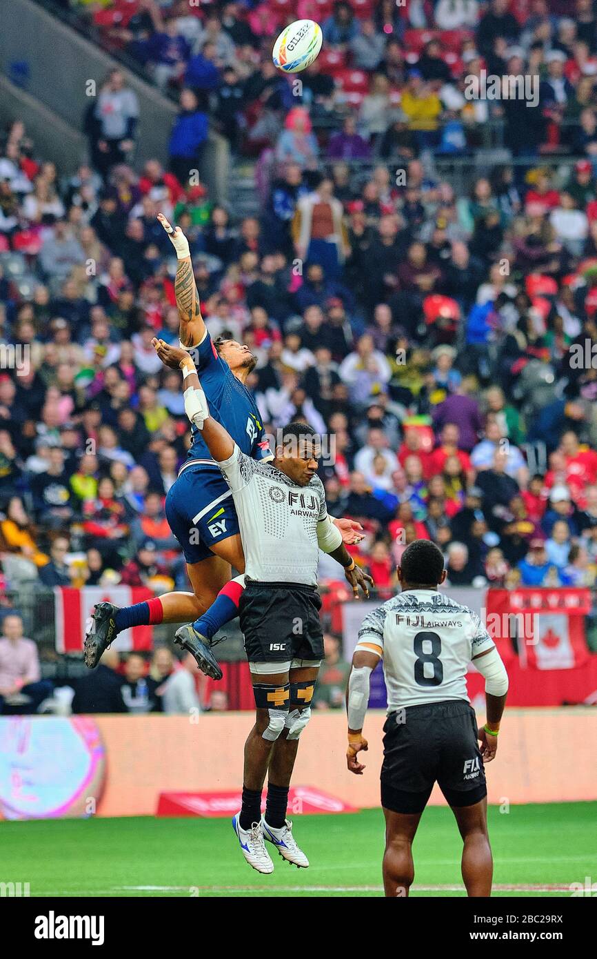 Vancouver, Canada. 8th March, 2020. Maka Unufe #8 of USA (left) jumps for the ball in Match #37 (5th Place Semi Final) during Day 2 - 2020 HSBC World Stock Photo