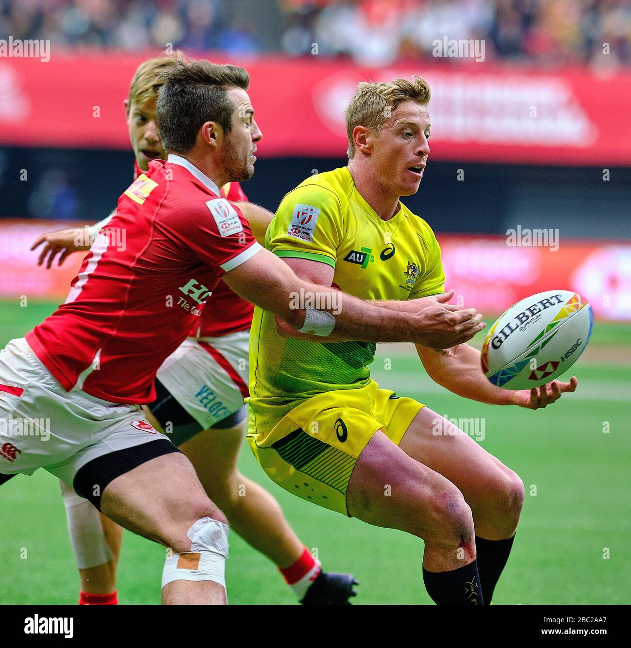 Vancouver, Canada. 8th March, 2020. Lachie Miller #5 of Australia passes the ball before tackled by Pat Kay #10 of Canada in Match #40 (Cup Semi Final Stock Photo