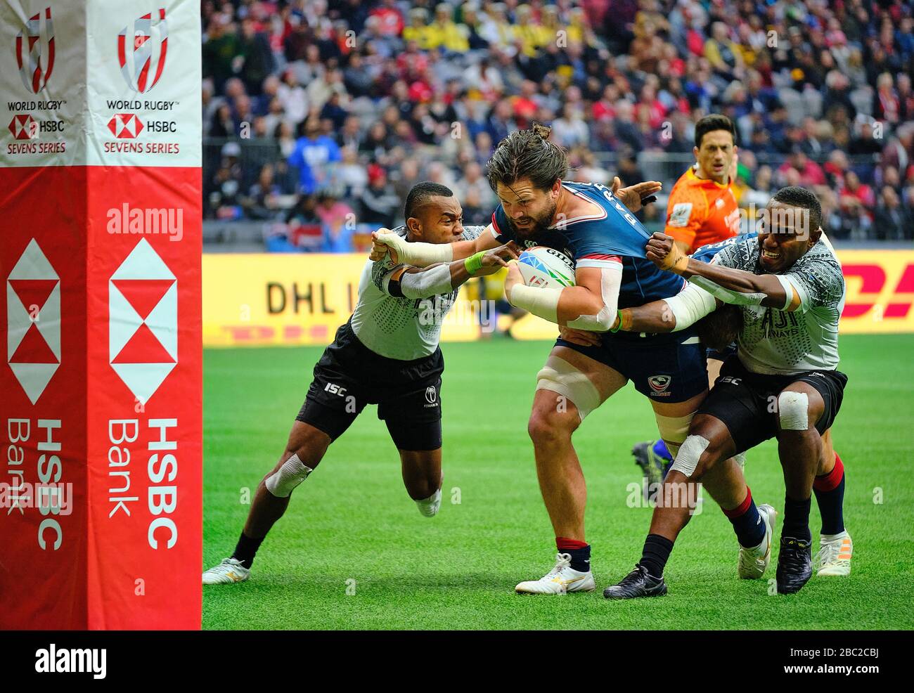 Vancouver, Canada. 8th March, 2020. Danny Barrett #3 (centre) of the USA tackled by Waisea Nacuqu #8 (right) and Alasio Naduva #10 (left) of Fiji in M Stock Photo