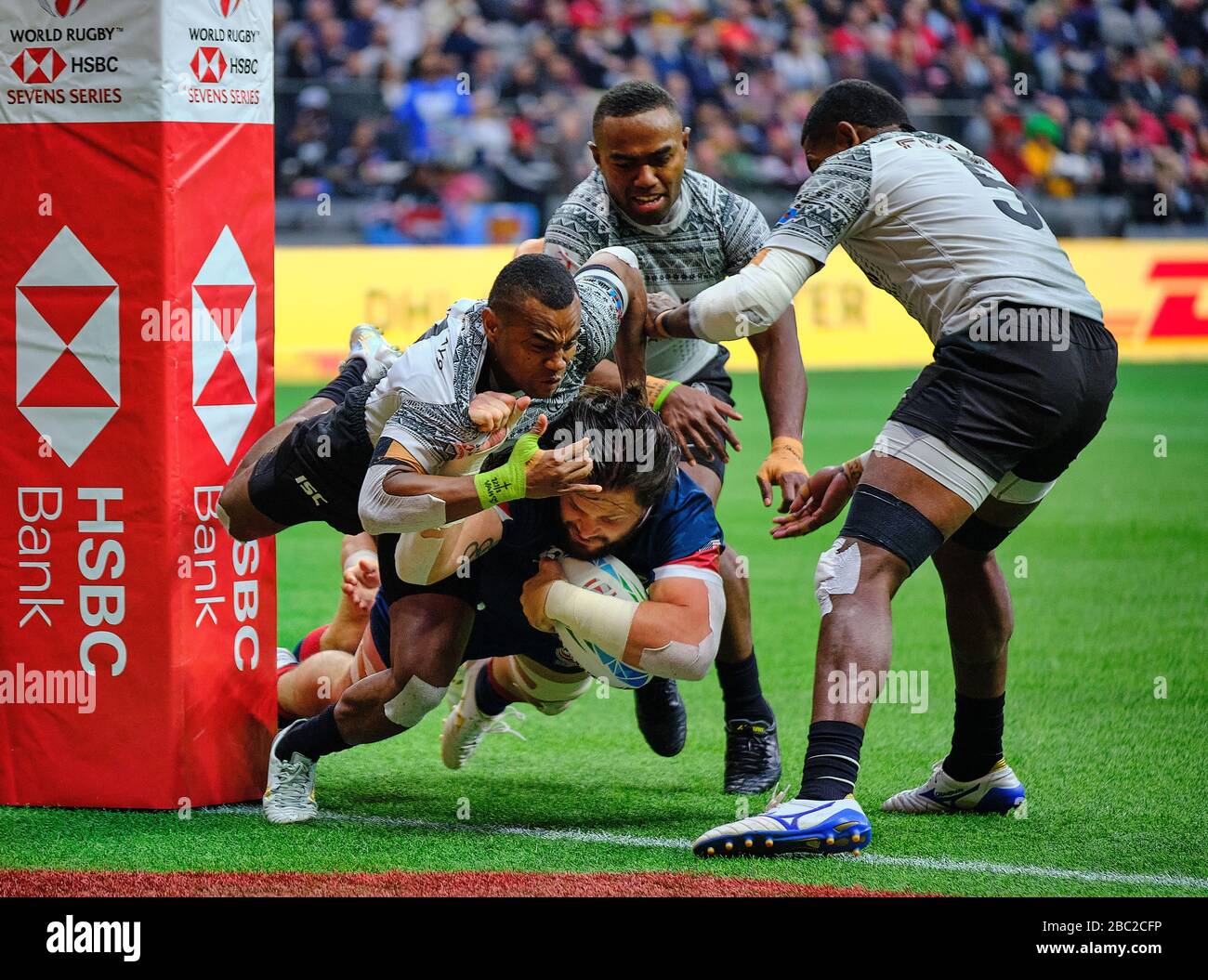 Vancouver, Canada. 8th March, 2020. Danny Barrett #3 (centre) of the USA tackled by Waisea Nacuqu #8 (right) and Alasio Naduva #10 (left) of Fiji in M Stock Photo