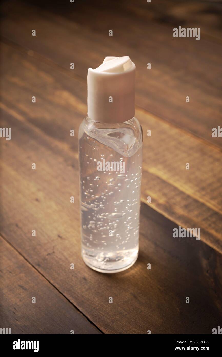 pocket hand sanitizer bottle on wooden background, useful for COVID19 pandemic concept Stock Photo