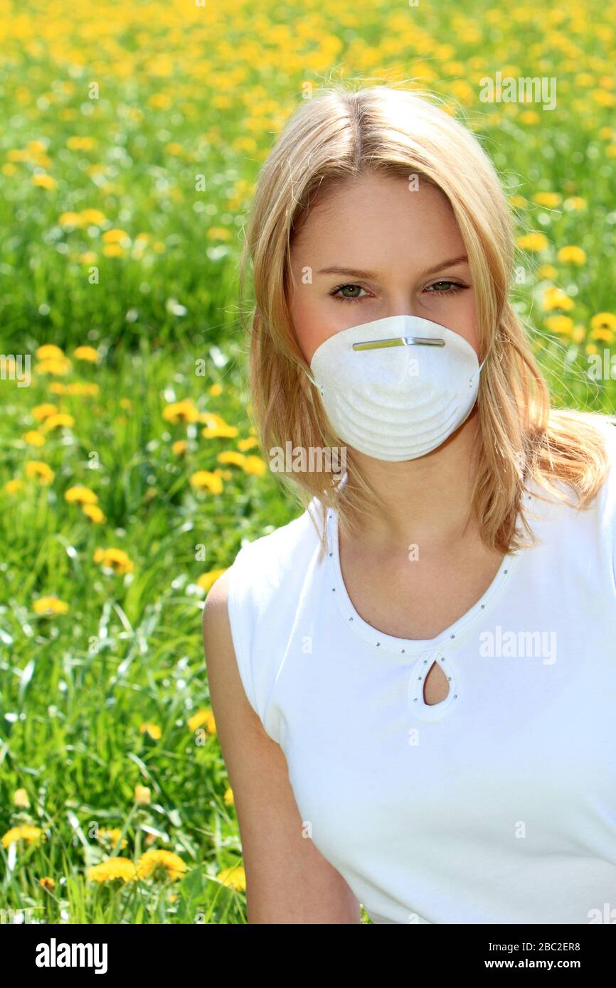 Woman wearing protective mask in corona crisis Stock Photo