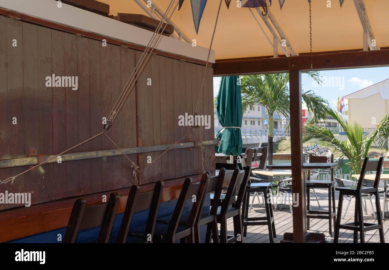 Normally busy this time of year, shutters are down at the Sint Maarten Yacht Club Bar & Restaurant in March 2020 for the Covid-19 Pandemic Stock Photo