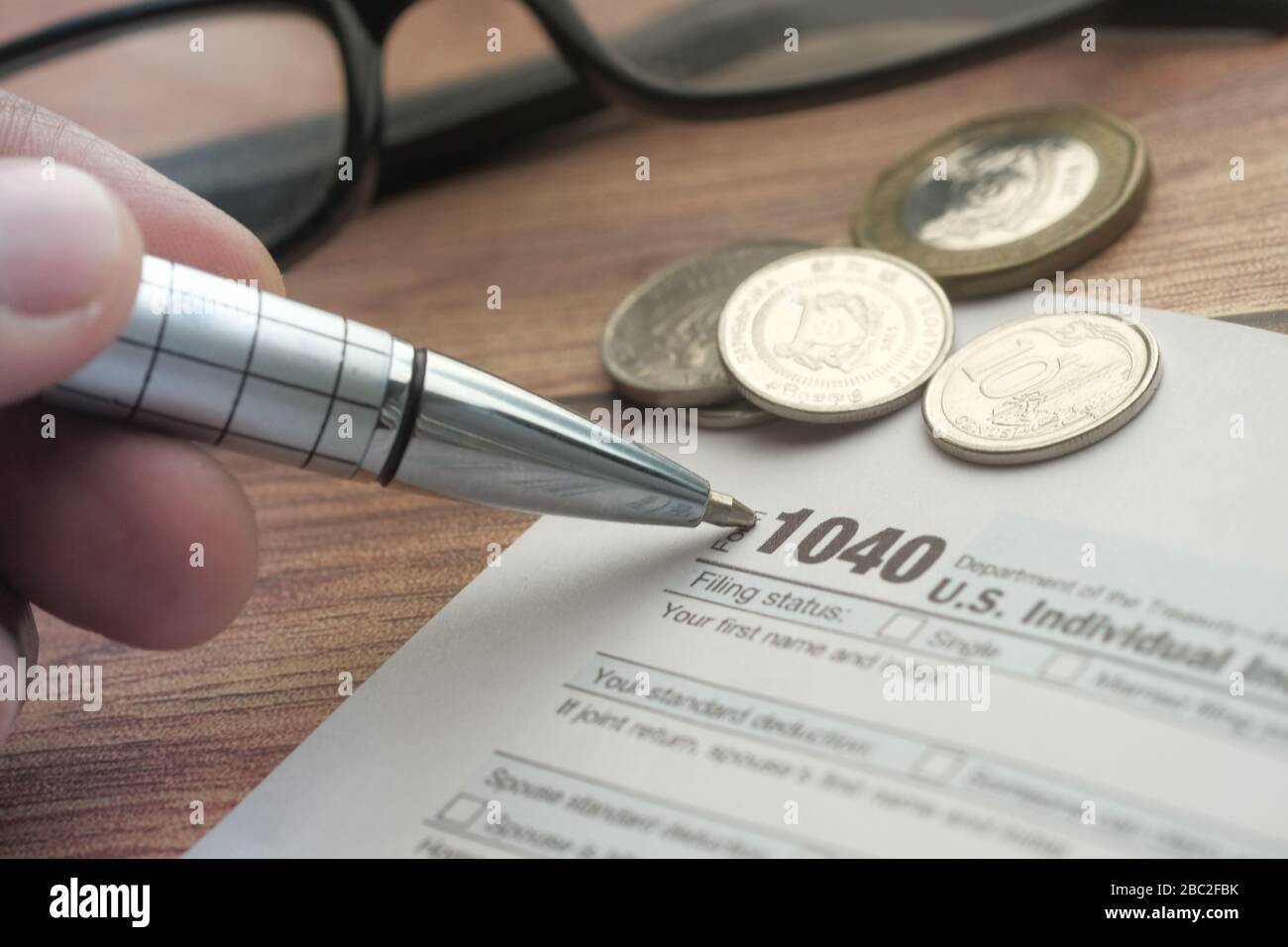 Us tax form pen taxation hi-res stock photography and images - Alamy