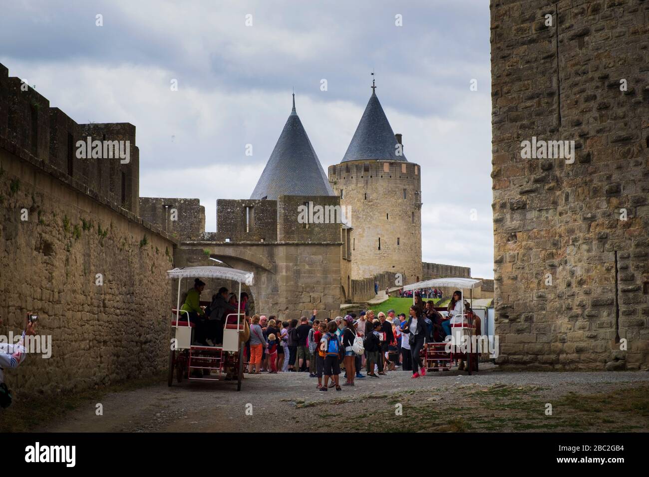 Tourists on the Horse Wagon Tour around Carcassonne Castle Aude France Stock Photo
