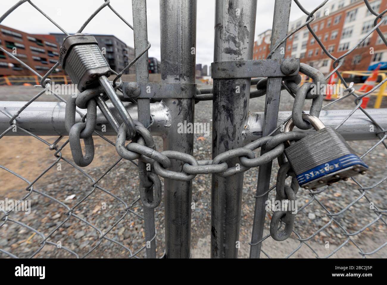 Locked gate on idle construction site, Boston, Massachusetts Stock Photo