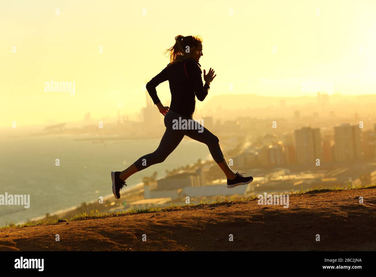 Full body profile of runner woman running at sunset in city outskirts Stock  Photo - Alamy