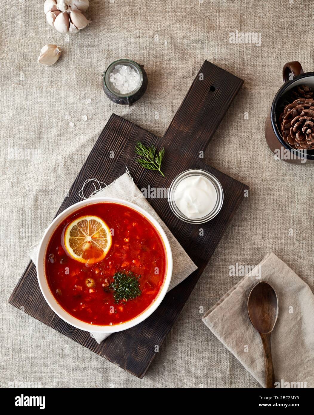Ukrainian soup Solyanka with cream on the table in country village house Stock Photo