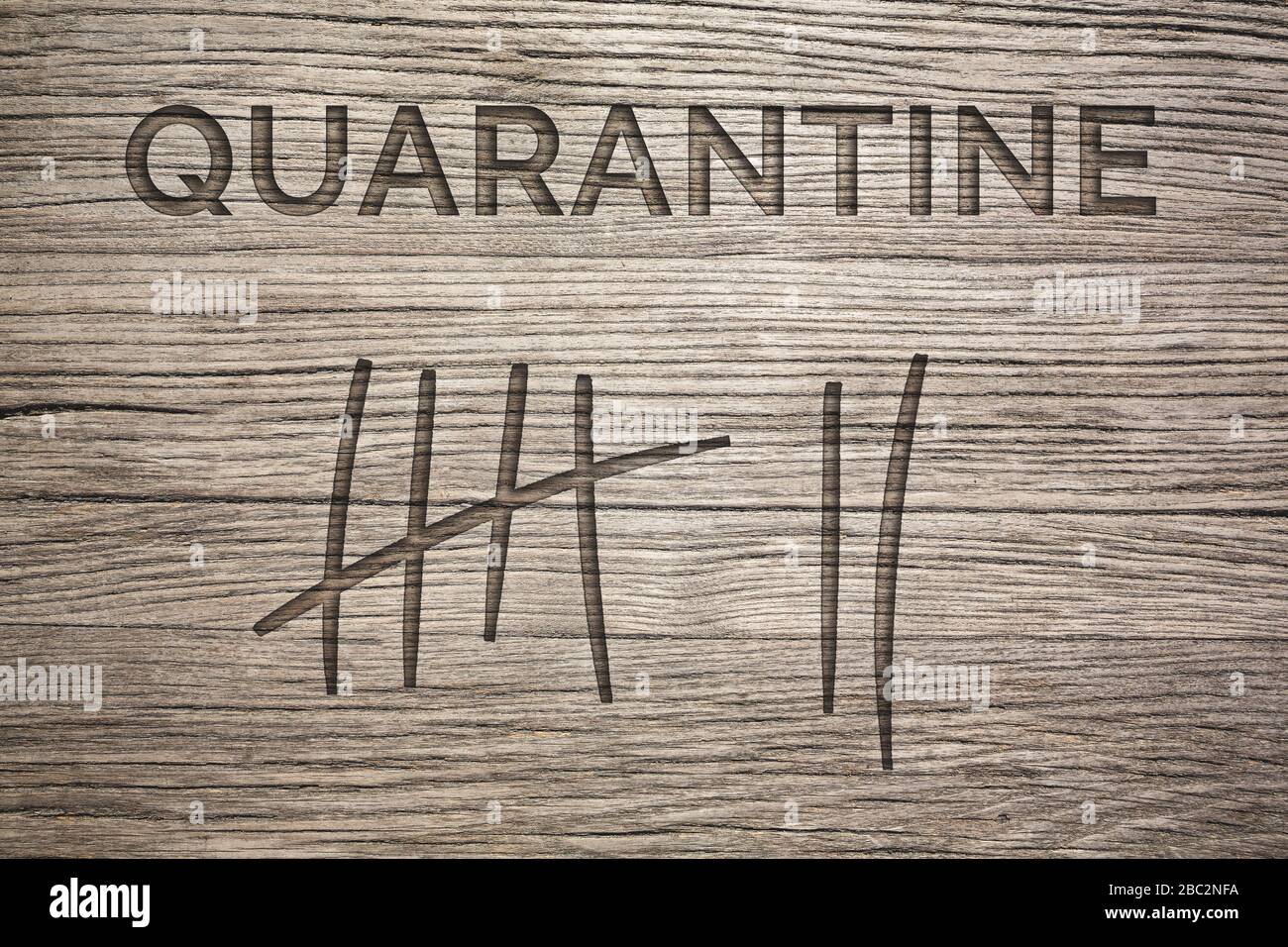Quarantine Duration Concept - markings on wood Stock Photo