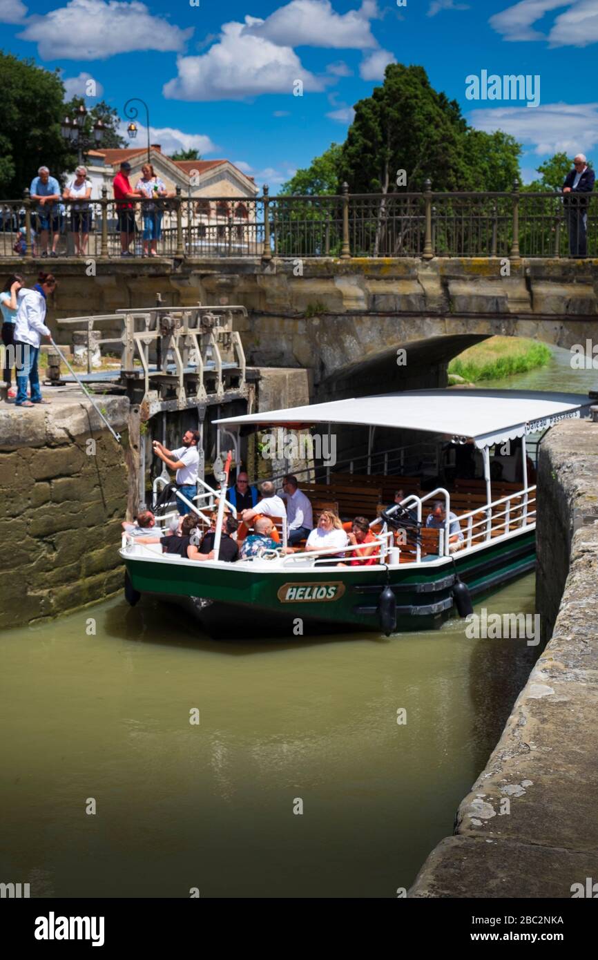 Boats passing the lock at the Pont Marengo  on the canal du Midi at Carcassonne Aude France Stock Photo