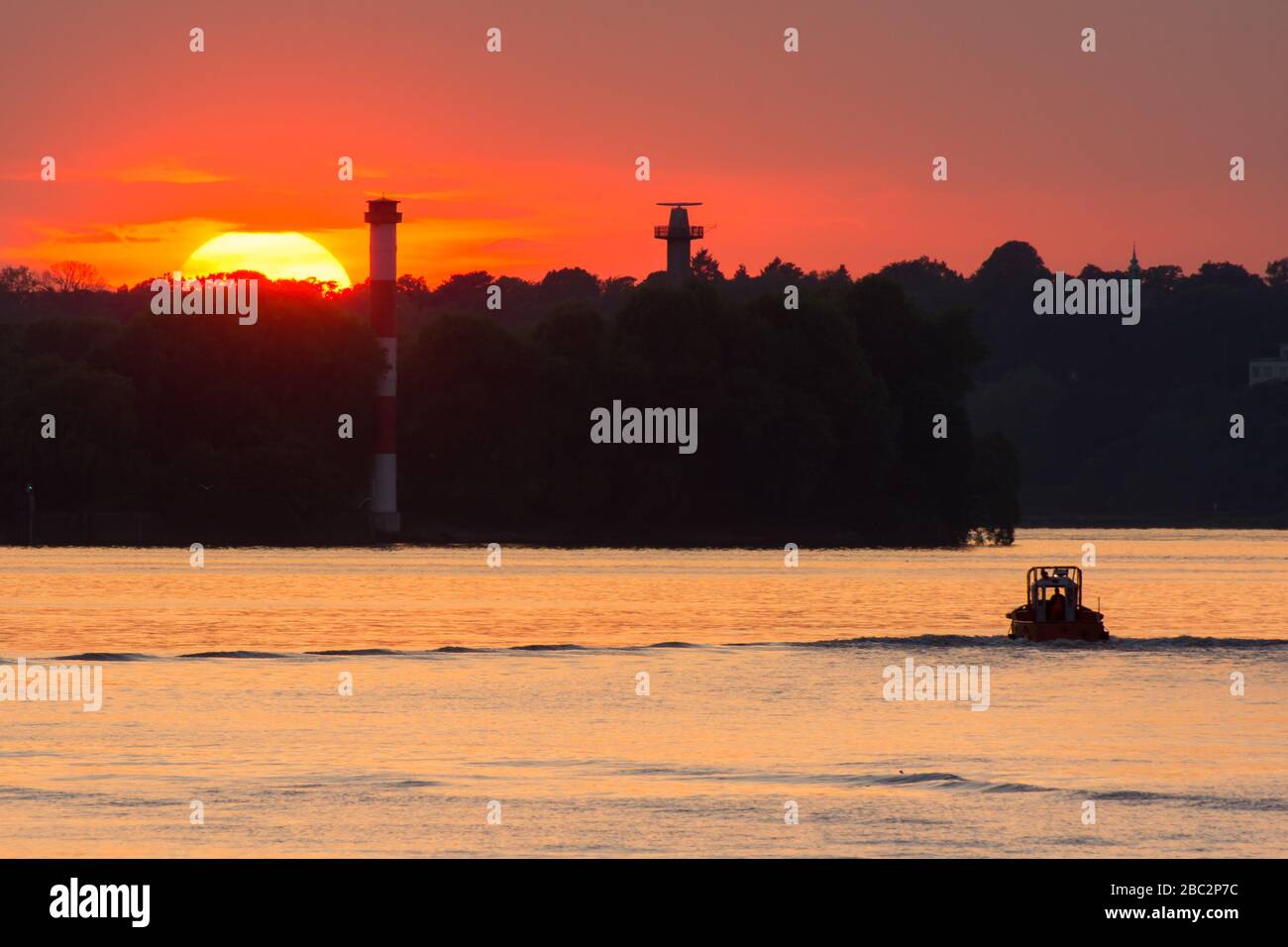 Sunset over the Bubendey bank in the port of Hamburg Stock Photo