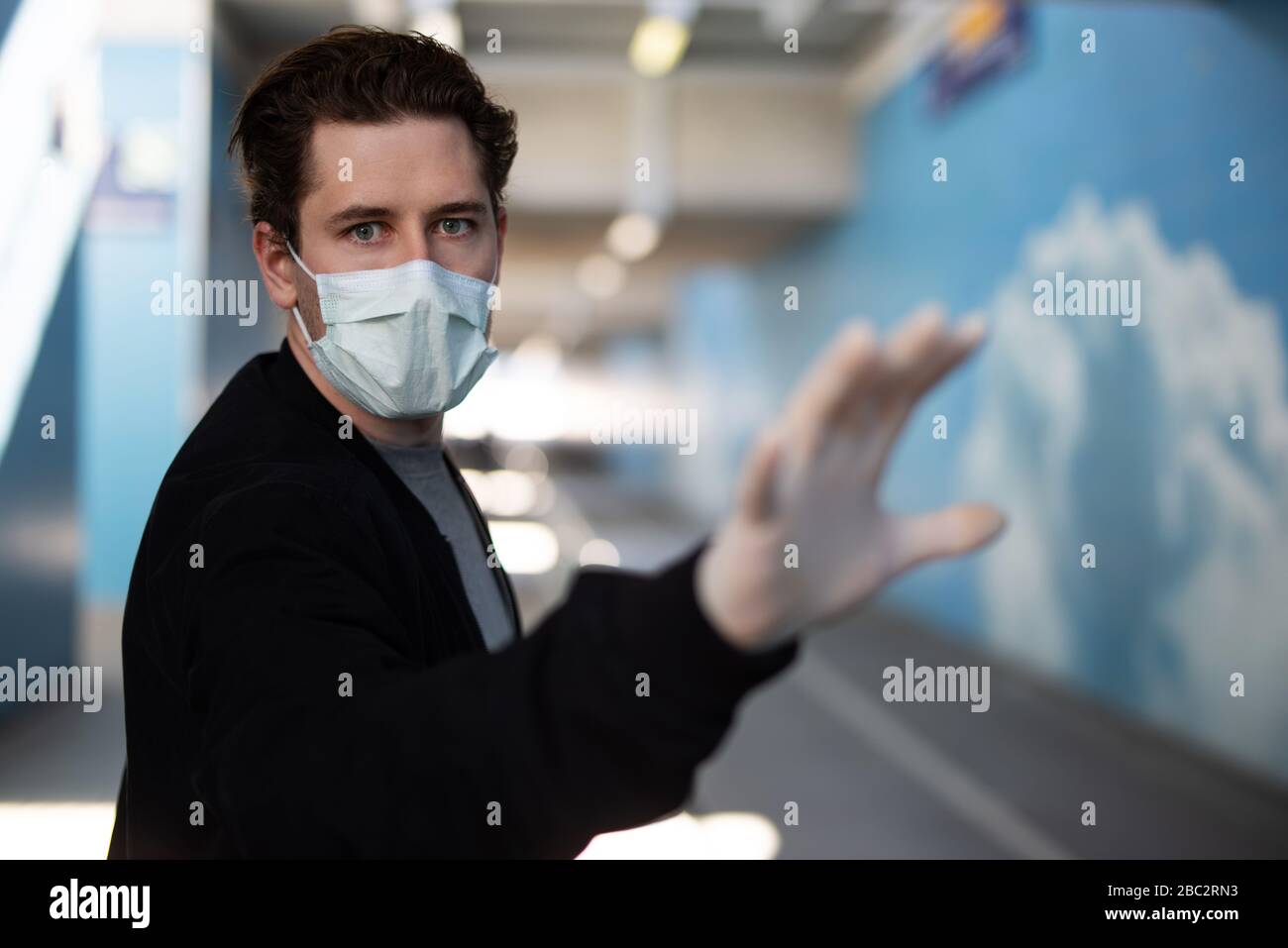 Portrait of a man wearing a breathing mask and rubber gloves at the time of the corona virus Stock Photo