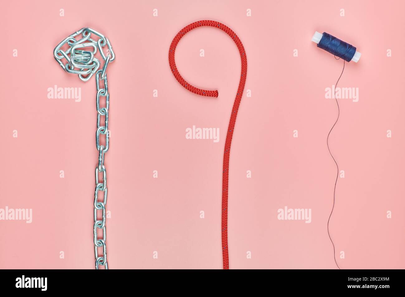 Chain, braided nylon rope and thread. Strength comparison concept