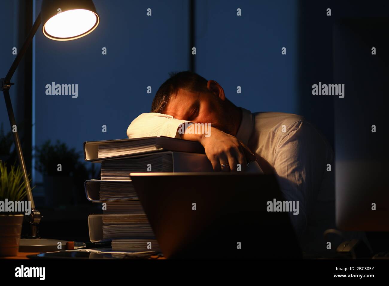 Tired male worker Stock Photo