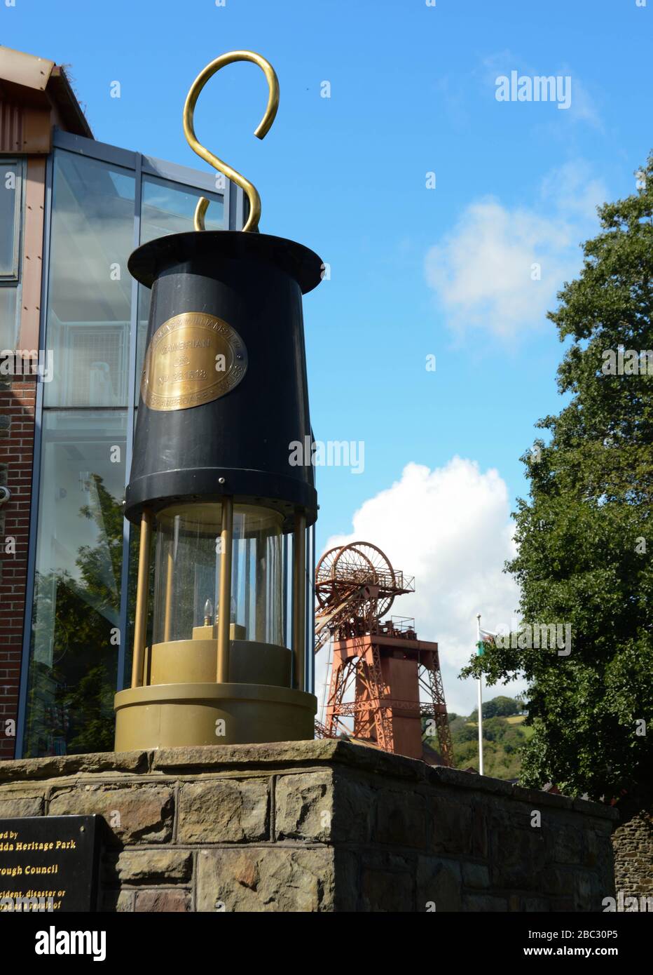 Porth, Wales - September 2017: A large scale reproduction of a traditional miner's lamp at the entrance to the Rhondda Heritage Park, Stock Photo