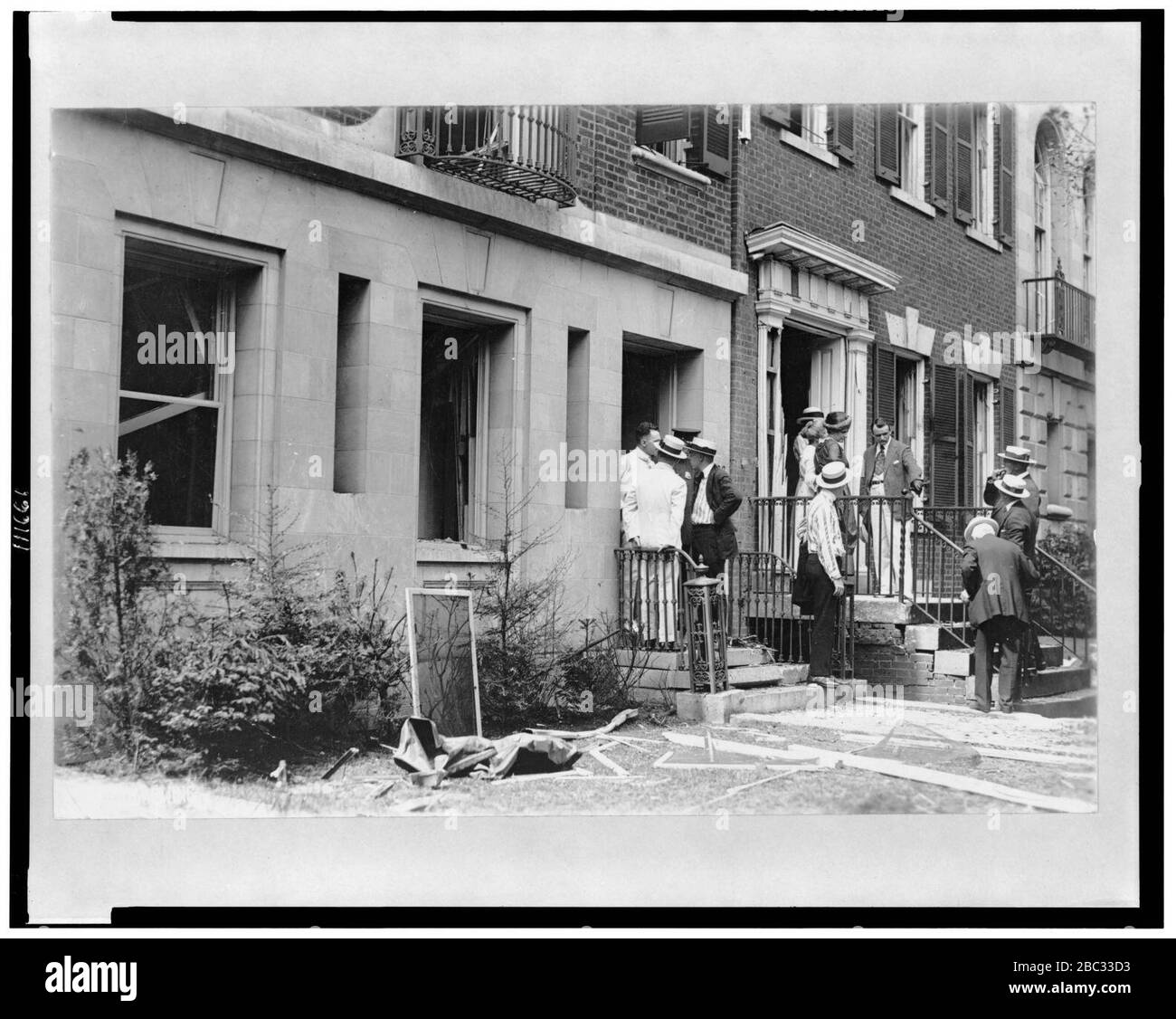 Group of people in front of home of Alexander Mitchell Palmer, after bomb explosion Stock Photo