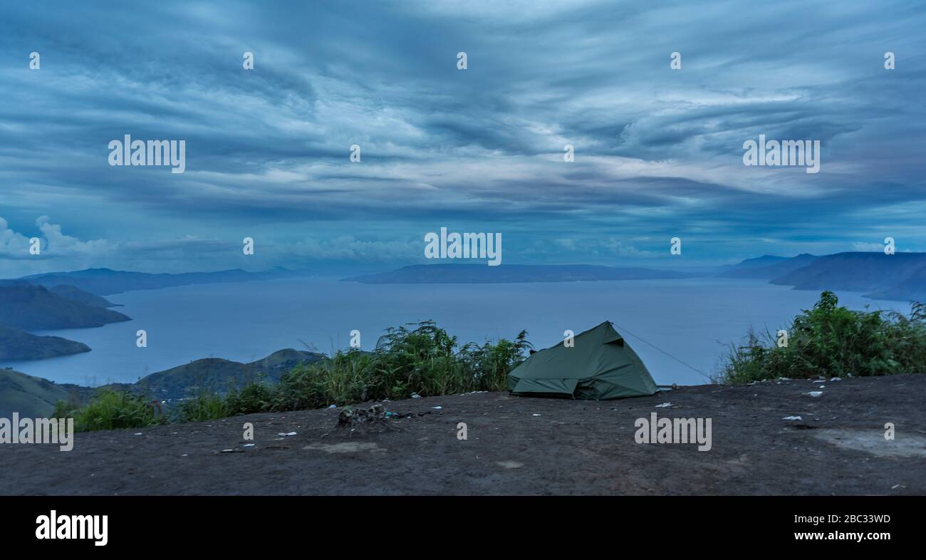 Remarkable camping location on top of the hill overlooking massive size of lake Toba, North Sumatra, Indonesia Stock Photo