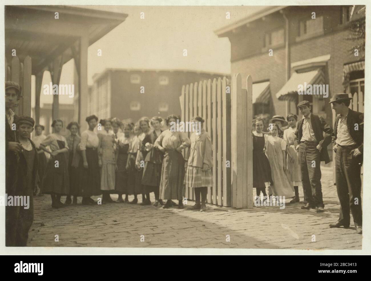 Group of workers in the Carding and weaving room of the Kilburn Mills