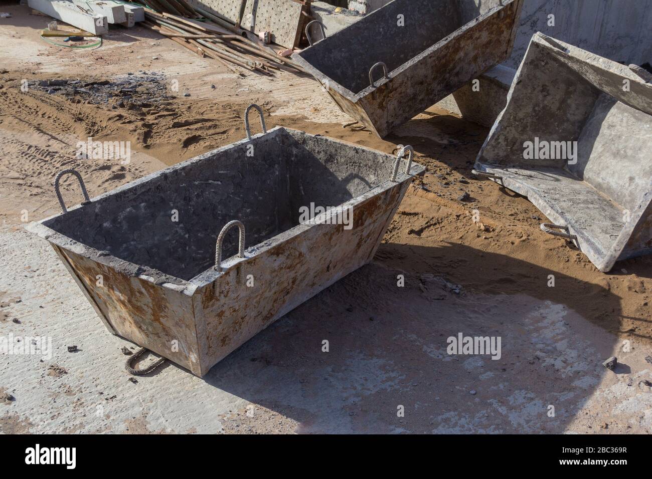 Construction concrete bucket. Tanks for transportation of concrete mix on a building site