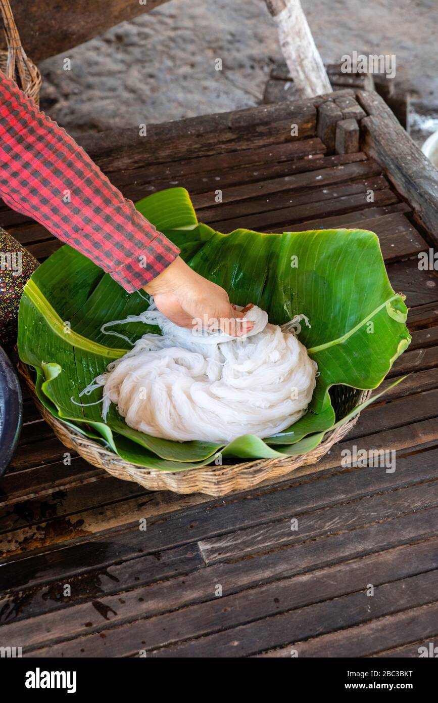 A woman packages rice noodles. Angkor Wat, Siem Reap, Cambodia Stock ...