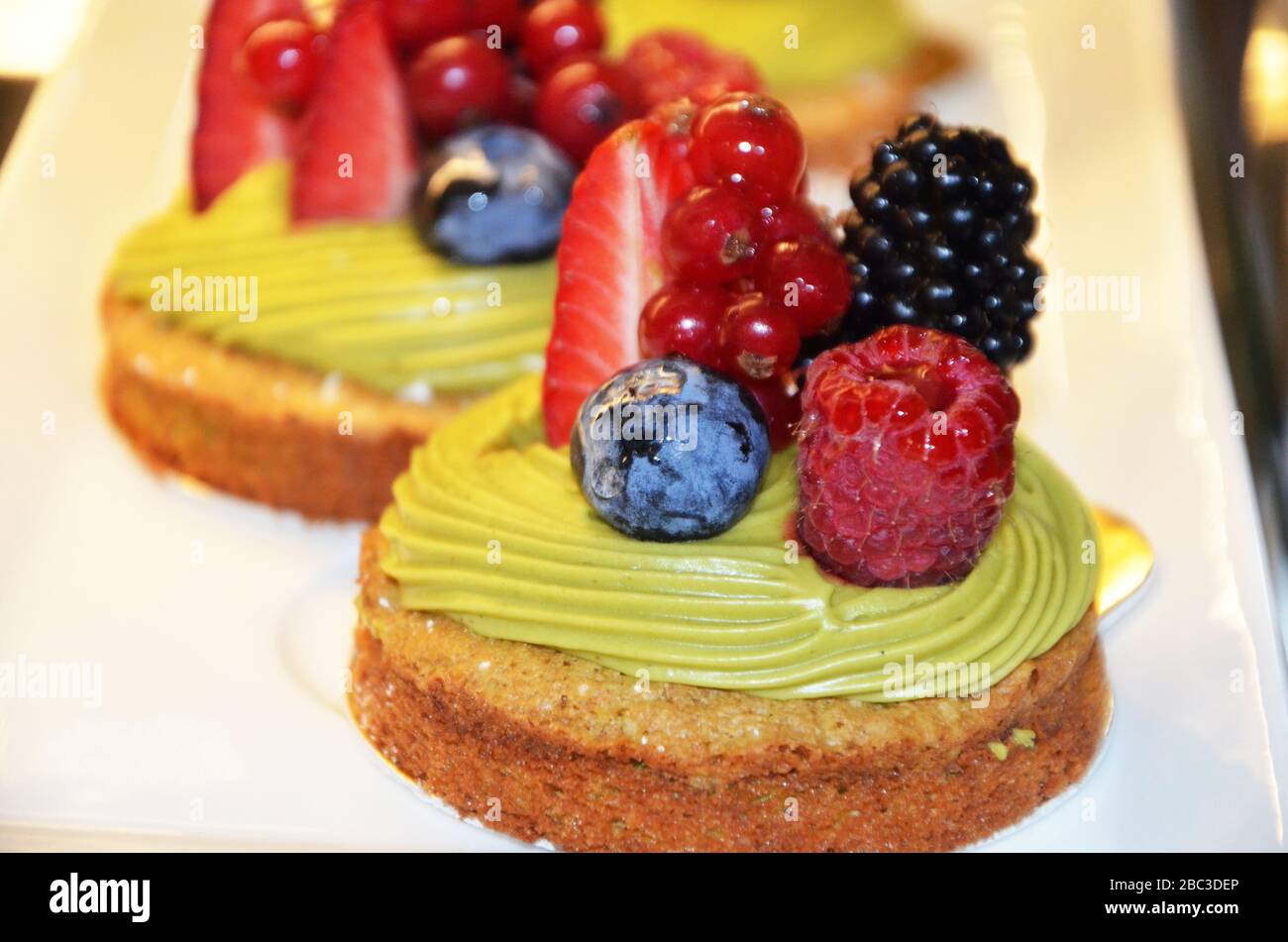 Fresh raspberries and pistachios hires stock photography and images