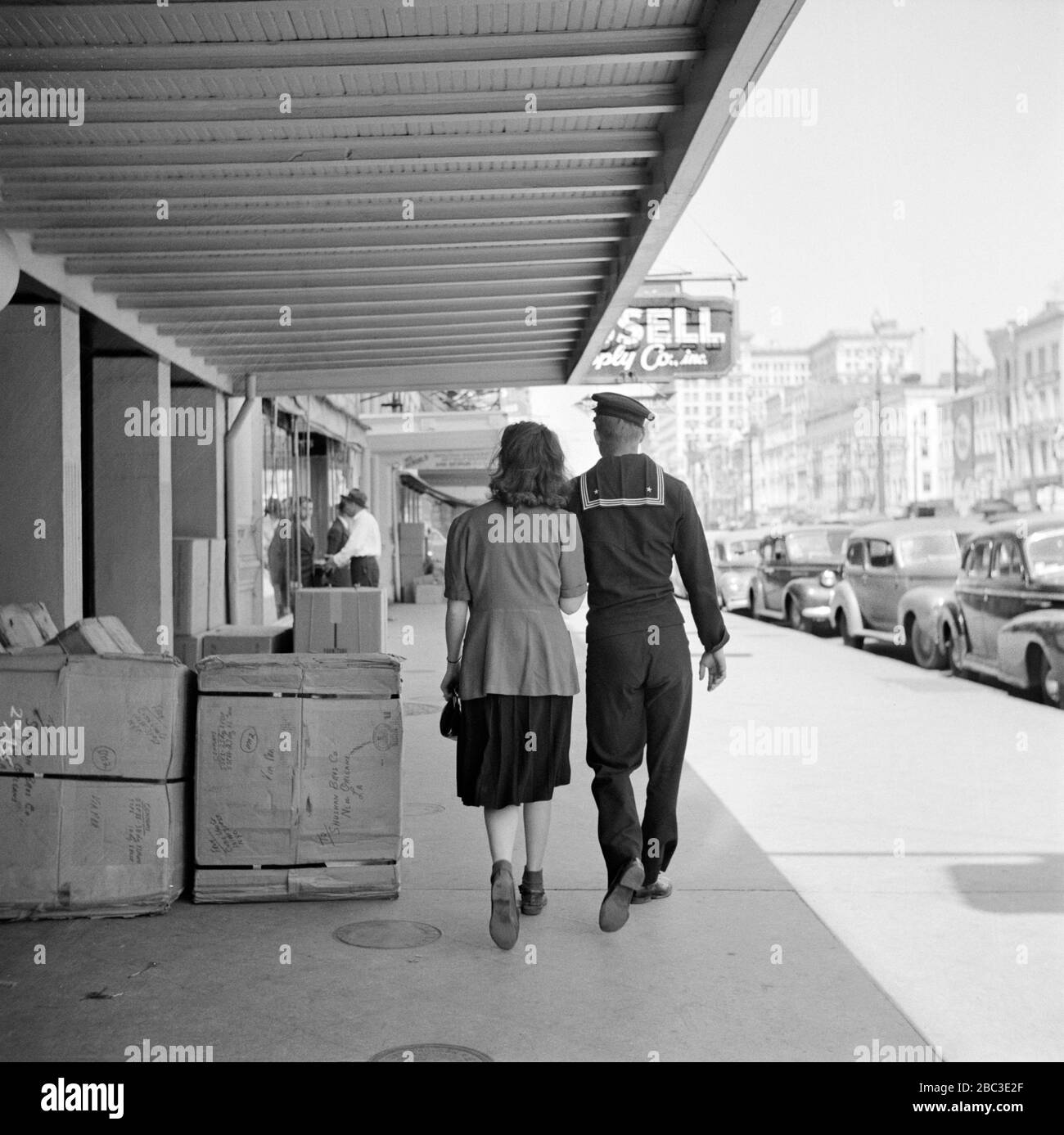 Sailor and Girl on Canal Street, New Orleans, Louisiana, USA, John Vachon for U.S. Office of War Information, March 1943 Stock Photo