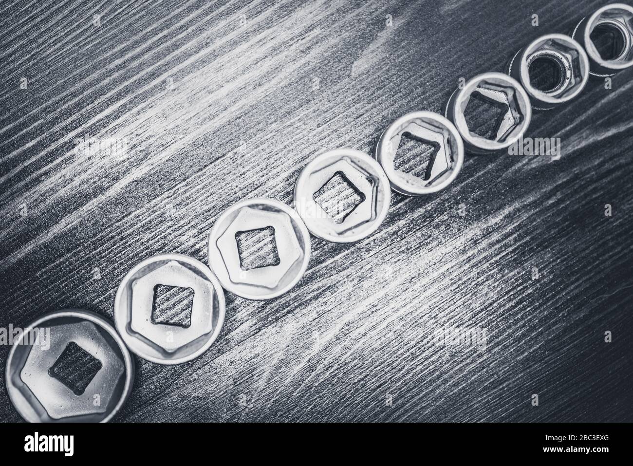 Socket wrenches on wooden floor Stock Photo