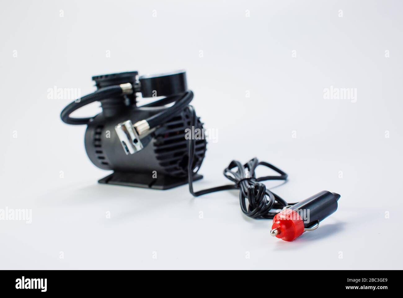 Car pump with manometer, air compressor on white background Stock Photo