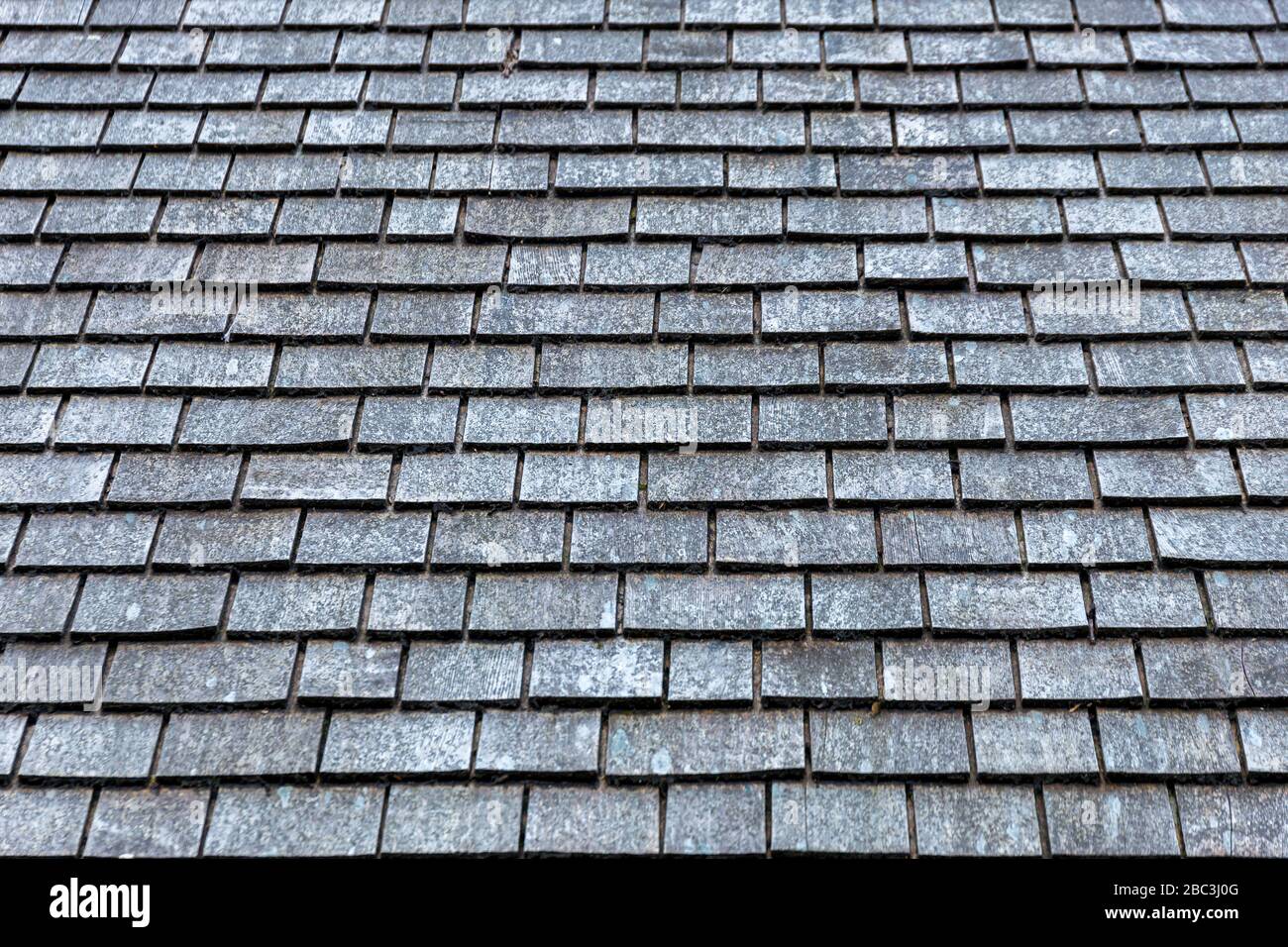 Grey slate roof tiles texture background image Stock Photo