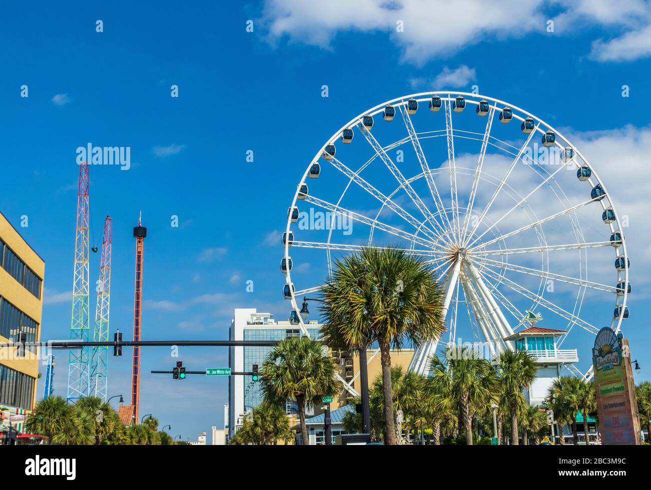 Ferris wheel in amusement park on Myrtle Beach Boardwalk along north ocean blvd in Myrtle Beach, South Carolina. Stock Photo