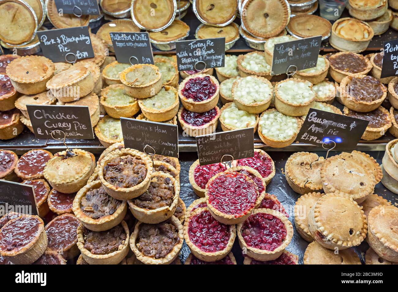 Pies on sale, deli counter, UK Stock Photo Alamy