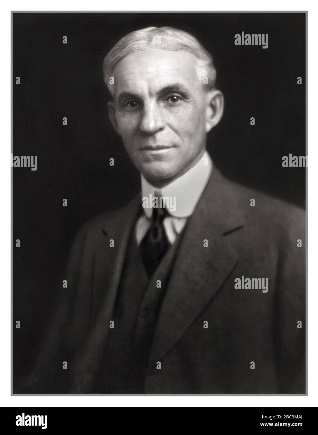 Henry Ford,1900's formal elegant studio portrait, founder, industrialist  benefactor and visionary of the American Ford Motor Company Inc.  Henry Ford Portrait Low Key Black Background USA America Stock Photo