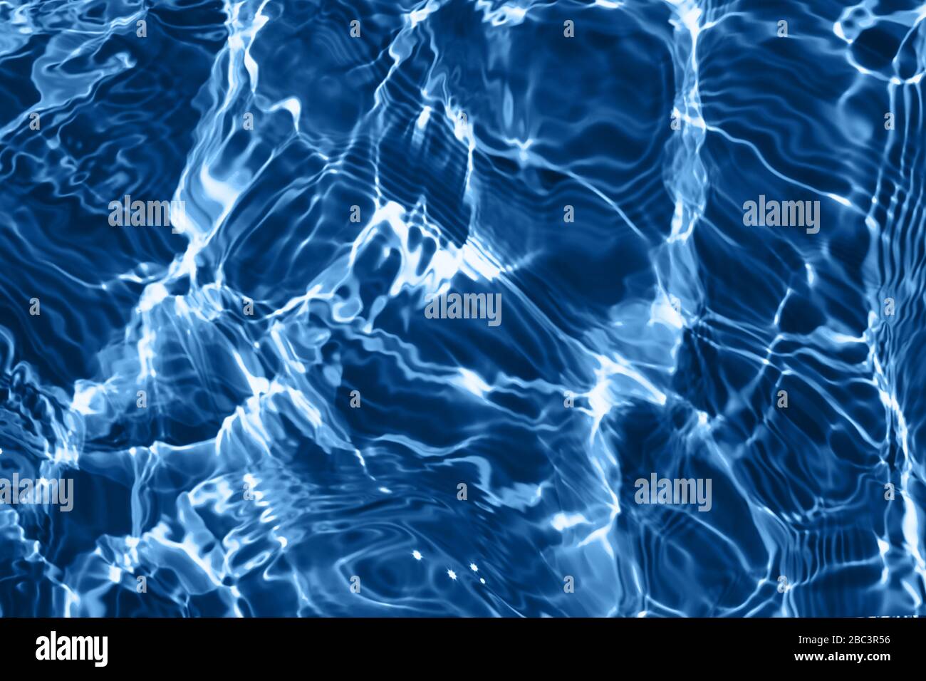 Closeup of rough water surface texture with splashes and bubbles in