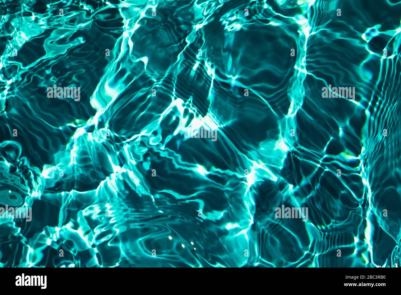 Closeup of rough water surface texture with splashes and bubbles in